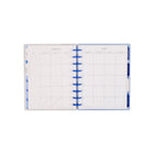 The Happy Planner 2026–2027 Classic Disc Bound Dated Planner - 9-3/4" x 5-5/16" - Cottage Blues-Features elegant covers and tabbed monthly dividers with cozy cottage-inspired designs in calming shades of blue