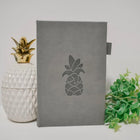 Wamaco Pineapple Planner Hard Cover Journal - 200 Lined Pages - Grey-Convenient – This beautiful book comes with an elastic closure and pen holder so when your ideas come it is easy to find.