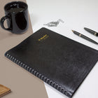 Blueline 2025-2026 Essential 16-Month Monthly Planner - 9-1/4" x 7-1/4" - Black - Bilingual-Certified under FSC license code: FSC C102682. The Forest Stewardship Council enables businesses and consumers to choose products made with materials sourced from responsible forestry, promoting environmentally appropriate, socially beneficial, and economically viable management of the world's forests