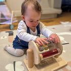 Learn Well Sight and Sound Drum-The entire drum spins at the slightest effort and the individual tubes spin as well - perfect for tummy time!