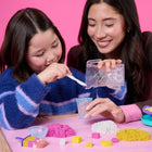 Kinetic Sand Smoothie Mixer Playset-Make smoothies & popsicles: Kids can create their own pretend play kitchen adventures as they craft fruity treats with 14 oz of pink, yellow & white Kinetic Sand, a mixer that really mixes sand, smoothie cup, popsicle mold & more