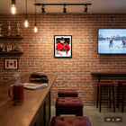 Frameworth Nick Suzuki Replica Signature Collage Hockey Canada 2026 - Framed Print - 16" x 20"-Professional collage design showcasing multiple action photos of Suzuki in the Hockey Canada 2026 jersey with replica signature overlay. Black wood composite frame with glass front protection