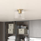 Hudson&Canal Henri 10" Wide Flush Mount with Glass Shade - Brass/Clear-Handcrafted brass finish is applied to the round metal base