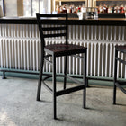 Flash Furniture HERCULES Series Black Ladder Back Metal Restaurant Barstool - Walnut Wood Seat-500 lb. Weight Capacity