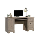 Sauder 59"W Sauder Select Desk - Laurel Oak- Storage area behind door holds vertical CPU tower and has an adjustable shelf