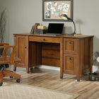 Sauder 59"W Carson Forge Desk - Washington Cherry- Lower drawer with full extension slides holds letter or legal size hanging files