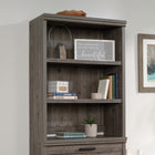 Sauder 433680 Aspen Post Library Hutch - Pebble Pine-Top features strong and lightweight 1" panel construction for durability and easy assembly.