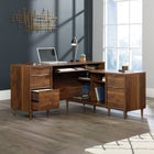 Sauder 59"W Clifford Place L-Desk - Grand Walnut- Three drawers with metal runners and safety stops conceal miscellaneous office supplies