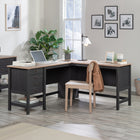 Sauder 65"W Cottage Road L-Desk - Raven Oak- Lower shelf for additional storage of books, binders, or an organizing bin
