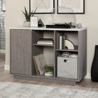 Sauder East Rock Accent Storage with Door - Ashen Oak-Hidden storage behind door features an adjustable shelf