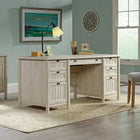 Sauder 65"W Costa Executive Desk - Chalked Chestnut- Pencil drawer and four storage drawers feature metal runners and safety stops