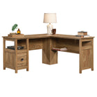 Sauder 59"W Cannery Bridge L-Desk - Sindoori Mango- Grommet holes and pass-throughs for cord management to keep your cord clutter neatly contained