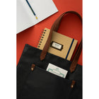General Supply Goods + Co Placard Notebook - B5 (6.9 x 9.8 in) - 180 Pages - Kraft Brown-Kraft colour notebook with Antique Brass Coil colour, and Black Elastic. Material of notebook is paper and hard carboard