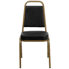 Flash Furniture HERCULES Series Trapezoidal Back Stacking Banquet Chairs with Black Vinyl & Gold Frame - 4 Pack-500 lb. Weight Capacity