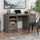 Sauder 60"W Aspen Post Desk - Pebble Pine-Open storage area features adjustable shelf.