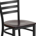 Flash Furniture HERCULES Series Black Ladder Back Metal Restaurant Chair - Walnut Wood Seat-Welded Joint Assembly