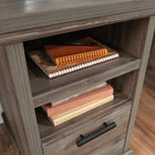 Sauder 60"W Aspen Post Desk - Pebble Pine-Cord management includes desk top grommets.