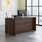 Sauder 59"W Affirm Desk - Noble Elm-   Cord management system with two desk top grommet holes to keep your desk clutter free