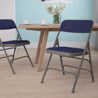Flash Furniture HERCULES Series Curved Triple Braced & Double-Hinged Navy Fabric Metal Folding Chair-Riveted Steel Components