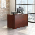 Sauder 47"W Affirm Desk - Classic Cherry- Cord management system with two desk top grommet holes to keep your desk clutter free